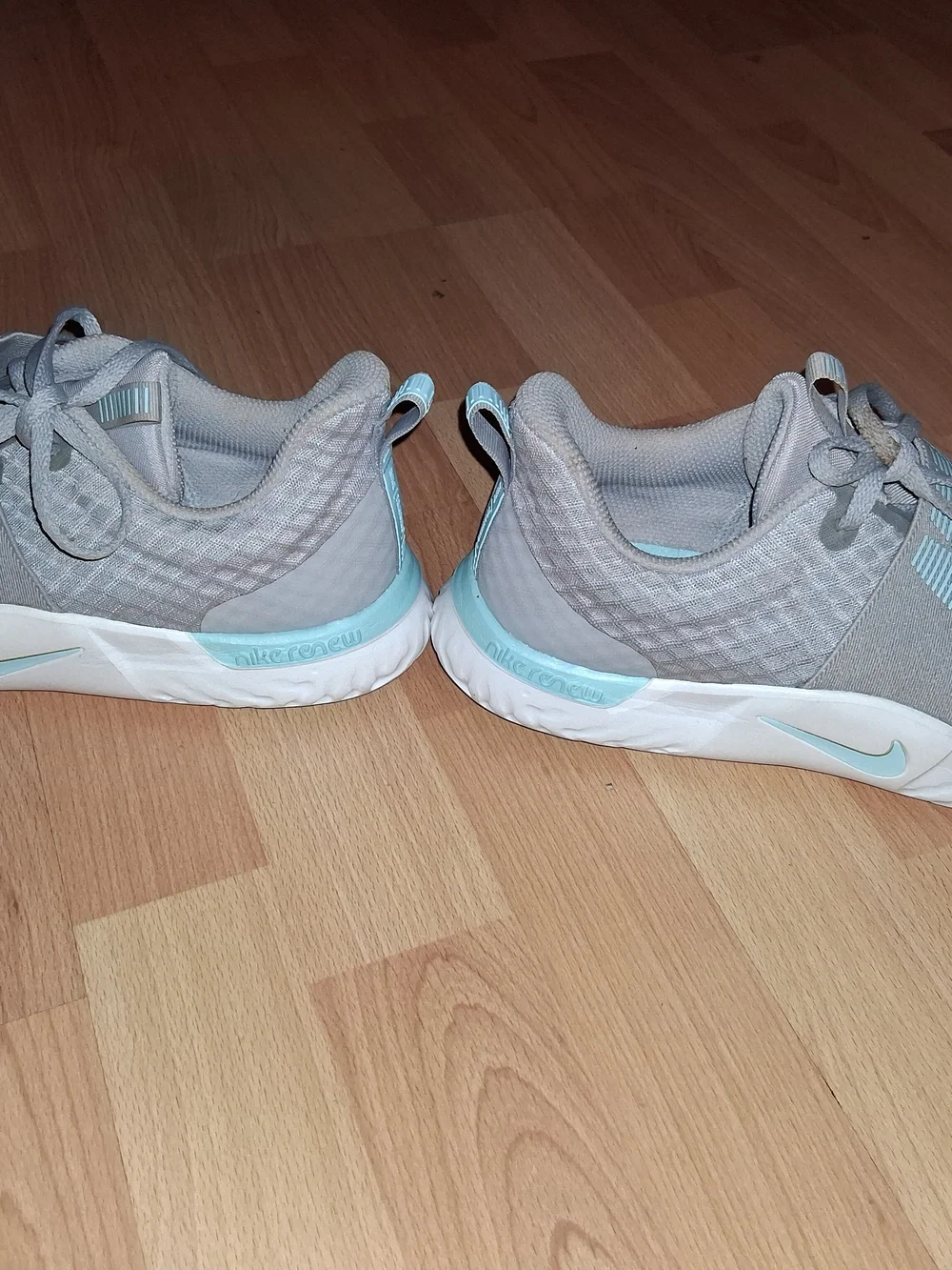 Nike Women's Light Gray Sneakers with Mint Accents